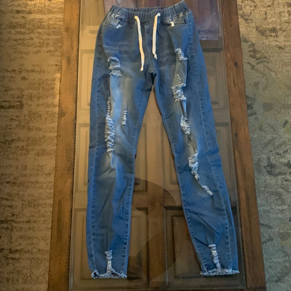 Tied ripped jeans